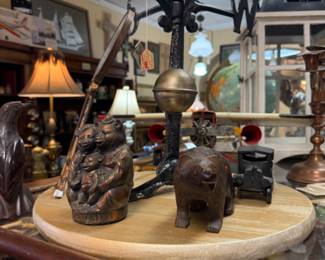 vintage airplane, carved bear figurines, weather vane