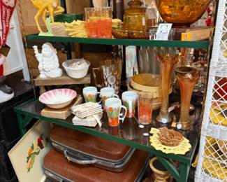 Vintage suitcases, wooden candlesticks, swung vases, vintage planters, amber glass bowls and glassware