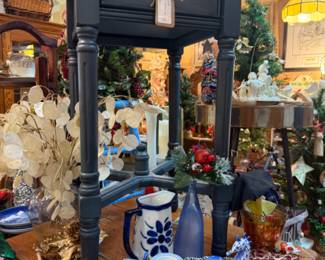 black, wood end table, blue and white figurines and pitcher