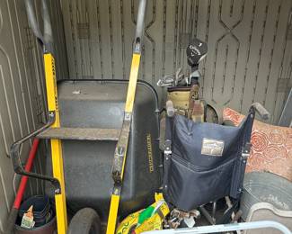 wheelbarrow and golf clubs and wheelchair
