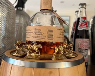 Shine a light on Excellence! Introducing the Blanton’s Illuminated Bottle Display Our new Barrel themed display pays homage to the iconic bourbon barrels of Warehouse H that make Blanton's famous. Meticulously handcrafted from premium wood, it is the perfect display for a bottle of Blanton’s and all 8 Blanton’s bourbon stoppers. Featuring a front engraved metal logo plate, felt lining to keep your stoppers in pristine condition and a light that shines up through the bourbon, illuminating both the soul and senses. 10 x 10 x 3 inches no liquor will be in the bottles 