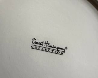 This is a set of dinnerware from the Ernest Hemingway Collection, featuring a shell pattern. The collection includes plates and bowls with colorful, hand-painted designs of shells in various colors such as purple, orange, and pink 30 Pieces many different shell patterns.