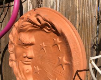 Terra-cotta face wall decor