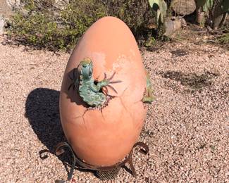 Large egg, dinosaur yard art