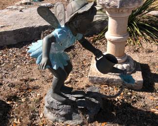 Brass child figure as a water feature