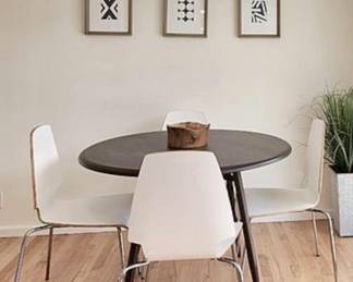 Round mod black dining table (white chairs not avail)