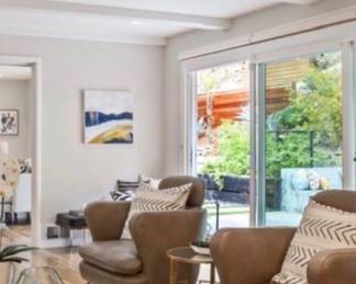 -Madalene modern tan leather wing chairs