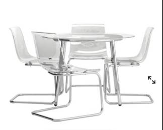 round chrome and glass dining (chairs not available)