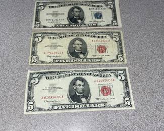 1950s red and blue seal five dollar bills