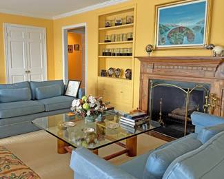 The Yellow Room - filled with paintings, fireplace items, and unique china and glassware.