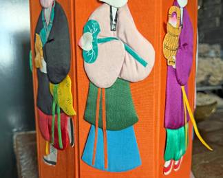 Vintage, collapsible , decorated with three-dimensional appliqué figures made of silk or fabric over a cardboard frame