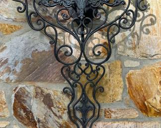 Large, ornate wrought iron wall sconce  