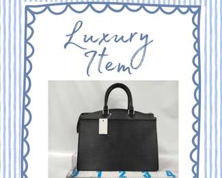 Authentic black Louis Vuitton Epi Riviera handbag in Epi leather.&nbsp;