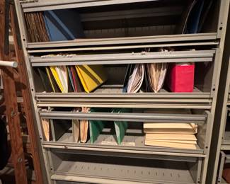 2 sets of file cabinets the shelves pull out and the front's pull down 