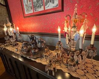 Large buffet with pair of ornate crystal candelabra style lamps. English tea set.