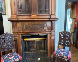Pair of Baroque Revival (or Renaissance style) chairs perfect for fireside chats, kilim upholstered.     Fabulous large Jacobean-style carved  fireplace surround and over mantle