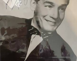 This is a black and white signed photograph of musician Tito Guízar.