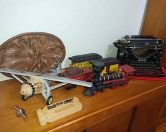 Vintage whiskey bottles and Underwood typewriter