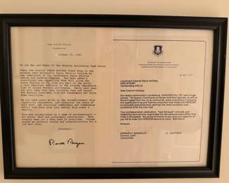 Framed original correspondence relating to the U.S. Space Shuttle Program and Vandenberg AFB.
Includes 1985 White House letter signed by President Ronald Reagan and U.S. Air Force command commendation addressed to Lt. Col. Stephen H. Holliday.