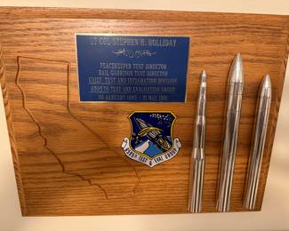 U.S. Air Force Cold War presentation plaque honoring Lt. Col. Stephen H. Holliday,
Peacekeeper (MX) ICBM and Rail Garrison Test Director, 6595th Test & Evaluation Group, Vandenberg AFB, 1987-1991. Machined metal display elements.