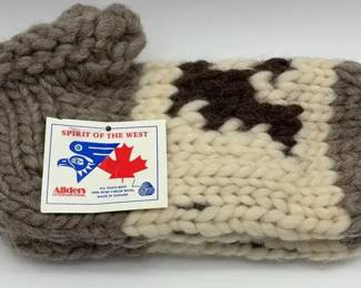 Handknitted 100 virgin wool slippers with a cow pattern. Made in Canada