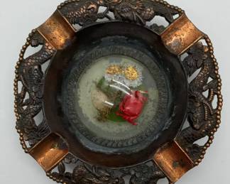 Vintage Japanese metal ashtray with dragon motif and preserved natural display.