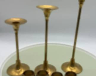 3 Brass Candlesticks And Four Napkin Rings 