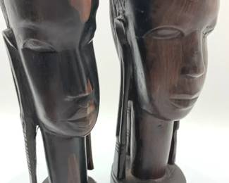 Pair of handcarved African ebony wood male and female busts.