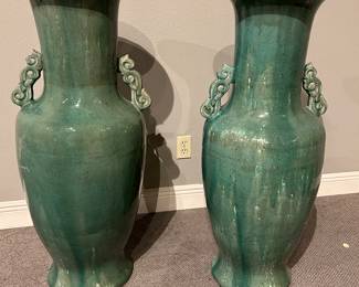 Pair of impressive  green terra cotta glazed vases41” high😍