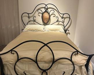 Hand forged iron bed with decorative painted panel on headboard, one of many pretty bedding sets ( sold separately) 