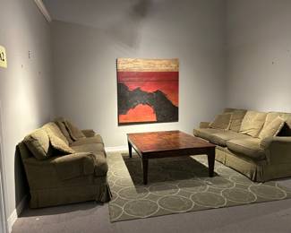 Pair of olive corduroy sofas , contemporary rug, statement art work  piece