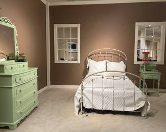 Cute painted green furniture and iron bed