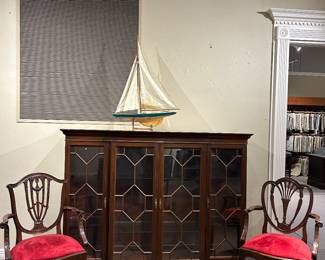 Lighted display case , English arm chairs 