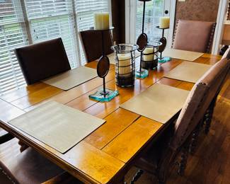 Beautiful harvest/rustic-yet-elegant table with six leather chairs. 