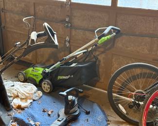 Several gas and electric lawnmowers