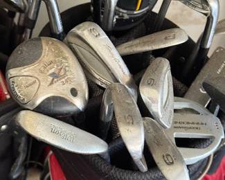 Three sets of golf clubs