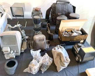 Various cameras + equipment, including Vintage Rollieflex, Olympus OM-2 SLR + lenses, Rondo 8mm movie editor