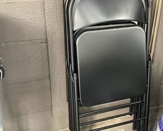 4 black folding chairs