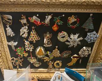 Many Christmas pins and brooches