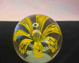 A full collection of handblown glass paperweights
