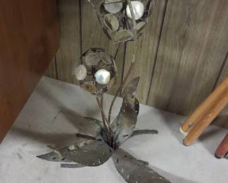 welded metal flower sculpture, often created in a Brutalist style 100-300