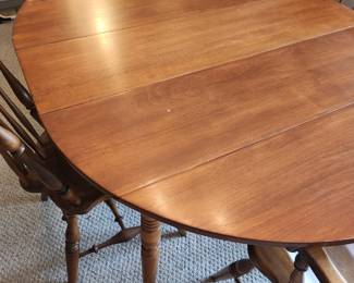 Round Table with 2 Leafs and 6 Maple Windsor Chairs. 
