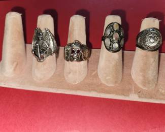From Left to Right....Silver Grim Reaper Ring. Silver Darth Vader Ring w/Ruby Eyes. Signed Silver Designer Ring. Silver Marine Corps Ring 1945. 