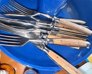 Lots of flatware and knives