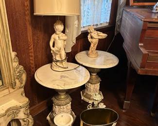 Vintage Metal Weibro trash can, vintage plaster Putti/Cherub table lamp, Grecian inspired urns, and a pair of marble top resin base side tables in excellent condition.