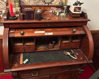 Antique roll top desk.  A little shaky but a stunning piece of history.