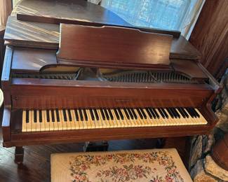 Brambach Baby Grand Piano.  Has sun damage on top and needs tuning but keys do not stick.  Stool is beautiful needlepoint and is priced separately.  