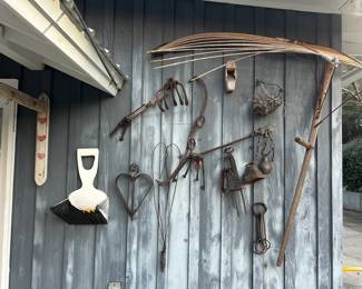 Assortment of displayed old tools all priced individually.