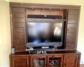 Solid Wood Entertainment center, with moving doors to disguise TV