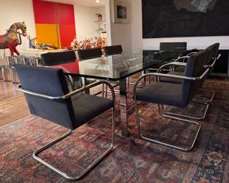Design Institute America (DIA) Architecturally Engineered Chrome & Glass Dining Table. Pictured with Set of 8 Mies van der Rohe BRNO Tubular Steel Armchair (Model 255), Designed in 1930. Table Measures 96" L x 42" W x 28.5" H with 27.5" Clearance. Chairs Measure 22" W x 24" D with 17" Seat Height. Photo 1 of 12. 